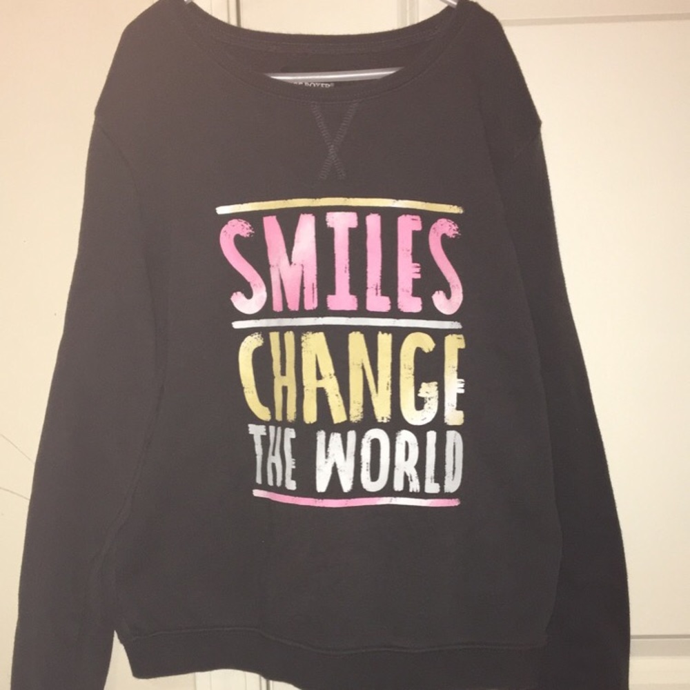 Dark grey “SMILES CHANGE THE WORLD” sweater